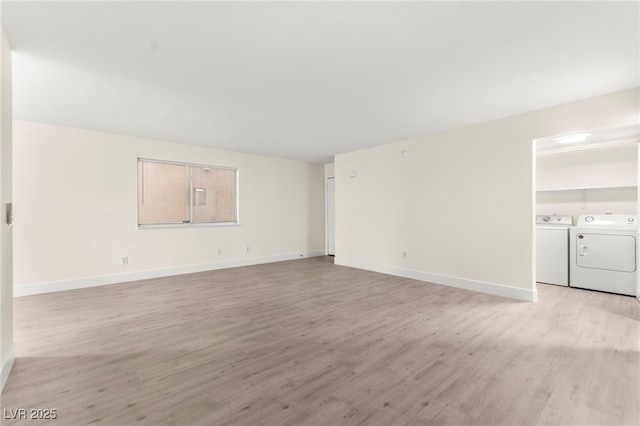 7566 Glowing Ember Ct Unit 101, Las Vegas, NV 89130 - unfurnished living room with separate washer and dryer, light wood-type flooring, and baseboards