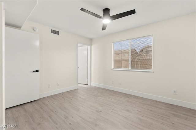 7566 Glowing Ember Ct Unit 101, Las Vegas, NV 89130 - unfurnished bedroom featuring wood finished floors, baseboards, and a ceiling fan