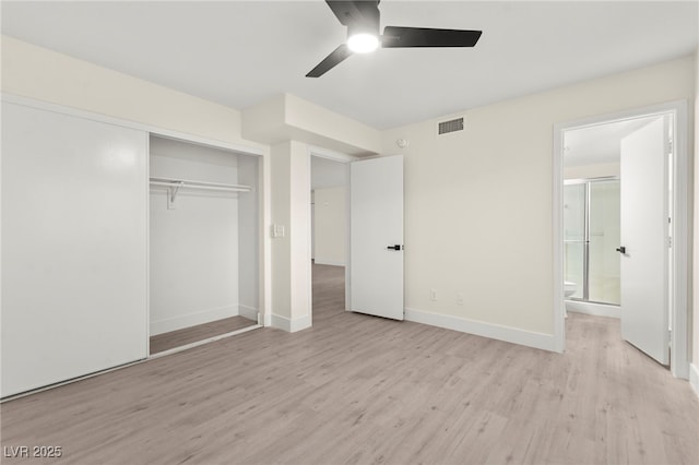 7566 Glowing Ember Ct Unit 101, Las Vegas, NV 89130 - unfurnished bedroom featuring light wood-style floors, a closet, baseboards, and ensuite bathroom