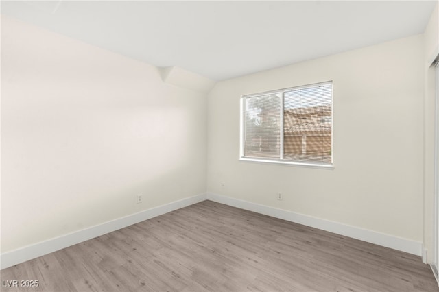 7566 Glowing Ember Ct Unit 101, Las Vegas, NV 89130 - unfurnished room with light wood-style floors and baseboards