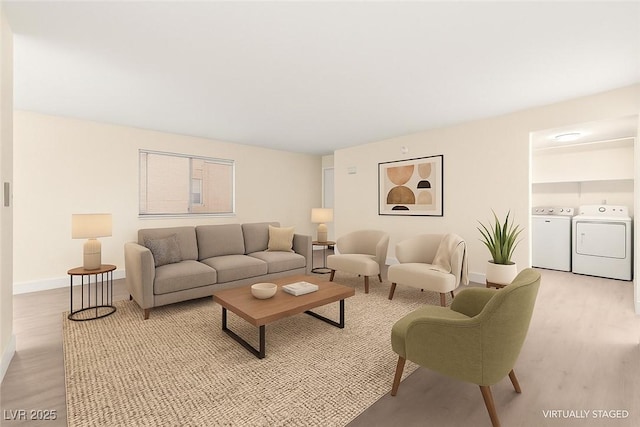 7566 Glowing Ember Ct Unit 101, Las Vegas, NV 89130 - living area with light wood-style floors, baseboards, and washer and clothes dryer