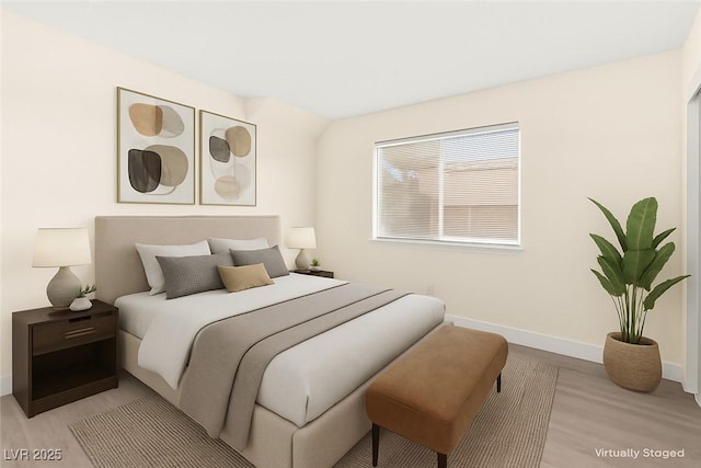 7566 Glowing Ember Ct Unit 101, Las Vegas, NV 89130 - bedroom featuring baseboards and light wood-style flooring
