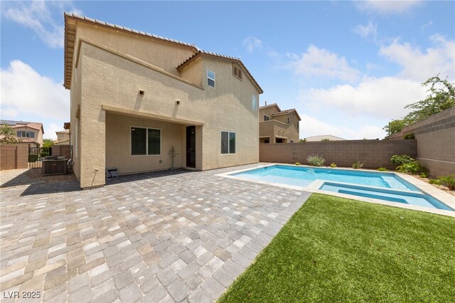 9839 Berkley Brook Ct, Las Vegas, NV 89141 - view of swimming pool featuring central air condition unit, a patio area, and a pool with connected hot tub