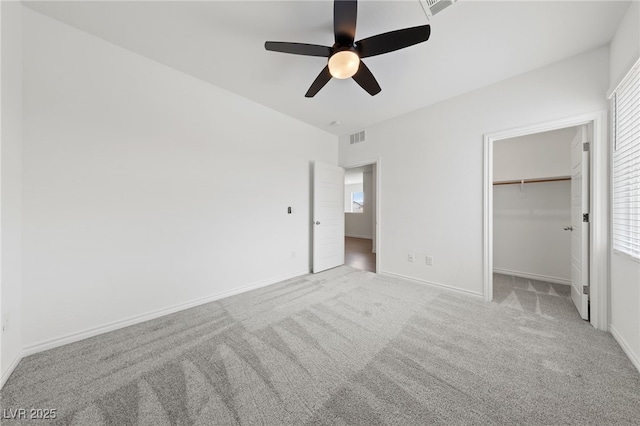9839 Berkley Brook Ct, Las Vegas, NV 89141 - unfurnished bedroom with carpet flooring, multiple windows, ceiling fan, and a spacious closet