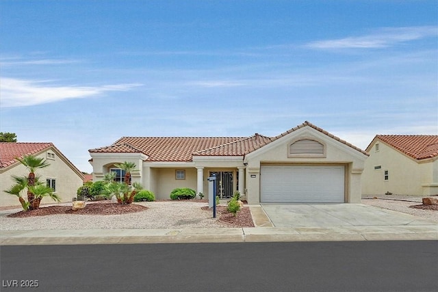 8513 Festival Dr, Las Vegas, NV 89134 - mediterranean / spanish home featuring driveway, an attached garage, a tile roof, and stucco siding