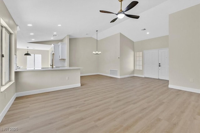 8513 Festival Dr, Las Vegas, NV 89134 - unfurnished living room featuring ceiling fan, light wood-type flooring, baseboards, a chandelier, and recessed lighting