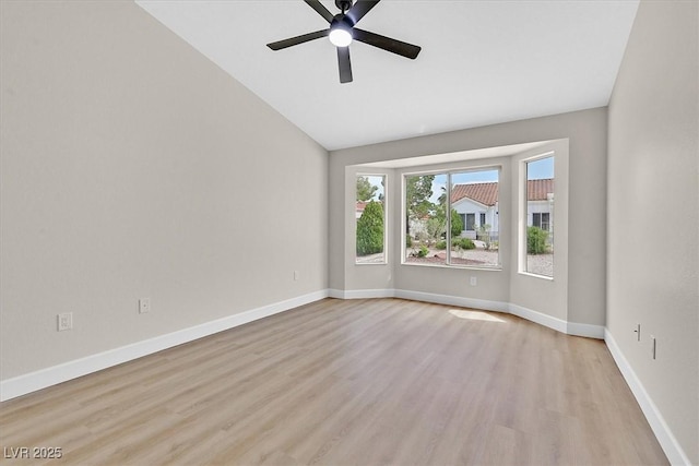 8513 Festival Dr, Las Vegas, NV 89134 - empty room featuring vaulted ceiling, light wood-style floors, a ceiling fan, and baseboards