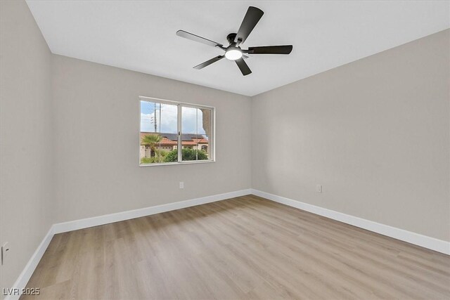 8513 Festival Dr, Las Vegas, NV 89134 - empty room featuring wood finished floors, ceiling fan, and baseboards