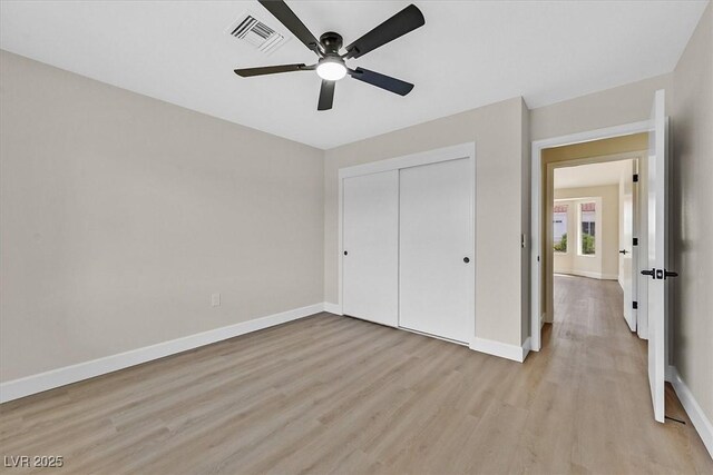 8513 Festival Dr, Las Vegas, NV 89134 - unfurnished bedroom with light wood-type flooring, baseboards, a closet, and ceiling fan