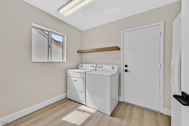 8513 Festival Dr, Las Vegas, NV 89134 - washroom with washer and clothes dryer, light wood-style floors, and baseboards
