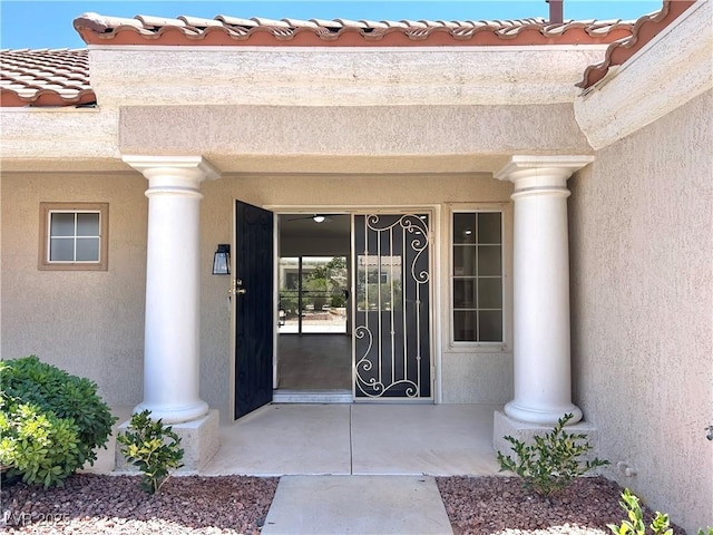 8513 Festival Dr, Las Vegas, NV 89134 - entrance to property with stucco siding and a tiled roof