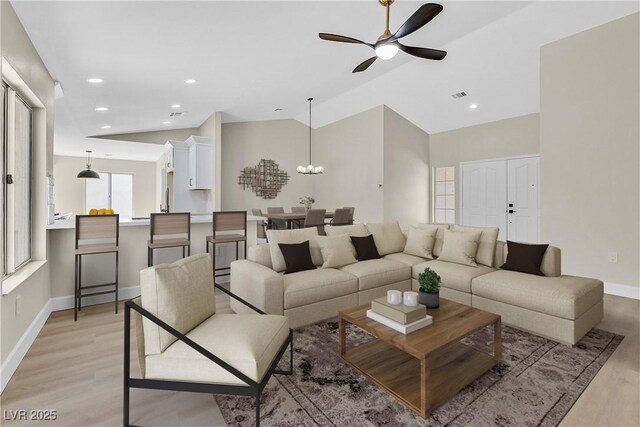 8513 Festival Dr, Las Vegas, NV 89134 - living room with light wood-style flooring, a ceiling fan, baseboards, recessed lighting, and vaulted ceiling