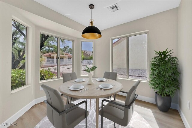 8513 Festival Dr, Las Vegas, NV 89134 - dining room with baseboards and light wood-type flooring