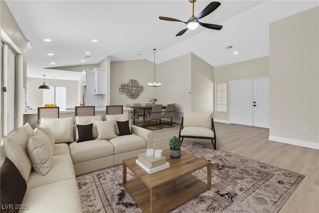 8513 Festival Dr, Las Vegas, NV 89134 - living room with ceiling fan, light wood finished floors, baseboards, recessed lighting, and a chandelier