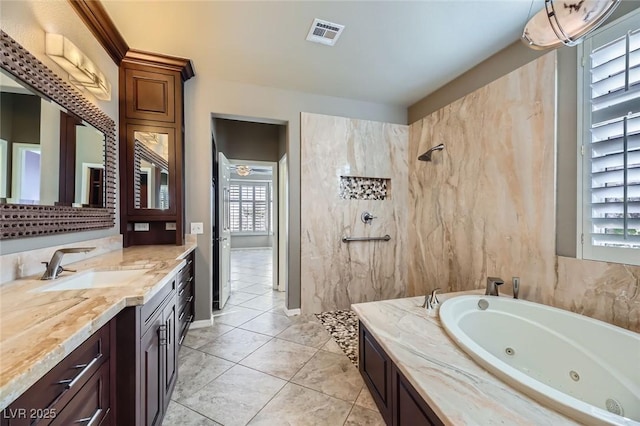 4750 Fiore Bella Blvd, Las Vegas, NV 89135 - full bath featuring a whirlpool tub, vanity, a tile shower, and tile patterned flooring