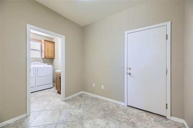 4750 Fiore Bella Blvd, Las Vegas, NV 89135 - spare room with washer and clothes dryer and baseboards