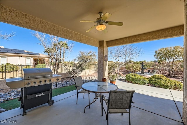4750 Fiore Bella Blvd, Las Vegas, NV 89135 - fenced backyard featuring a patio, area for grilling, a ceiling fan, and outdoor dining space