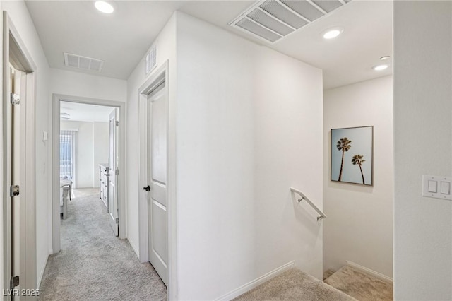 6807 Satin Silver Ct, North Las Vegas, NV 89086 - hall with light carpet, recessed lighting, and an upstairs landing