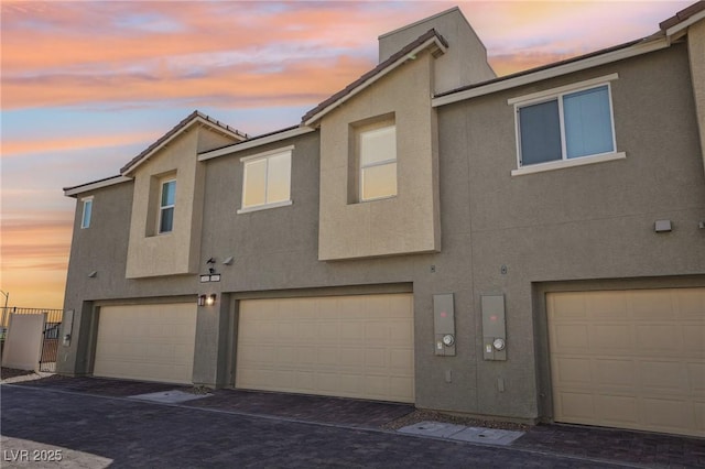 6807 Satin Silver Ct, North Las Vegas, NV 89086 - view of property featuring stucco siding and an attached garage