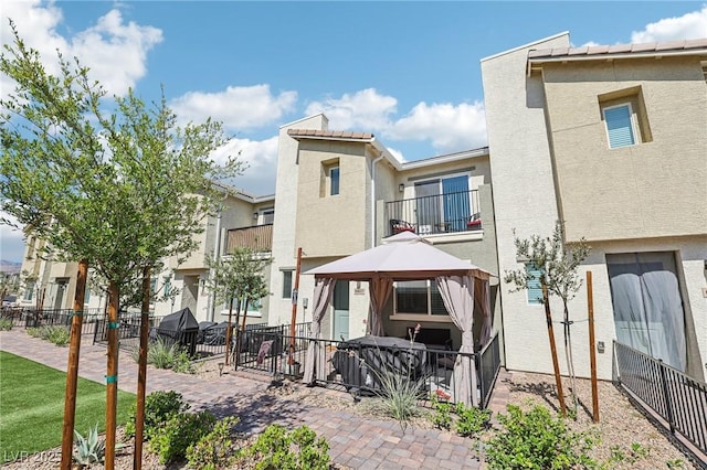 6807 Satin Silver Ct, North Las Vegas, NV 89086 - rear view of property featuring a gazebo, stucco siding, and a patio