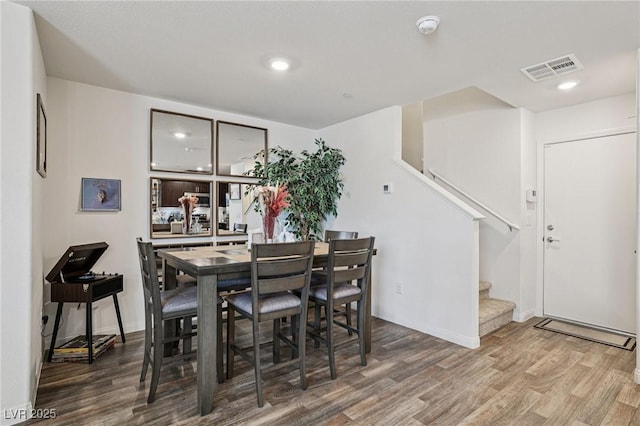 6807 Satin Silver Ct, North Las Vegas, NV 89086 - dining space with wood finished floors, stairs, recessed lighting, and baseboards