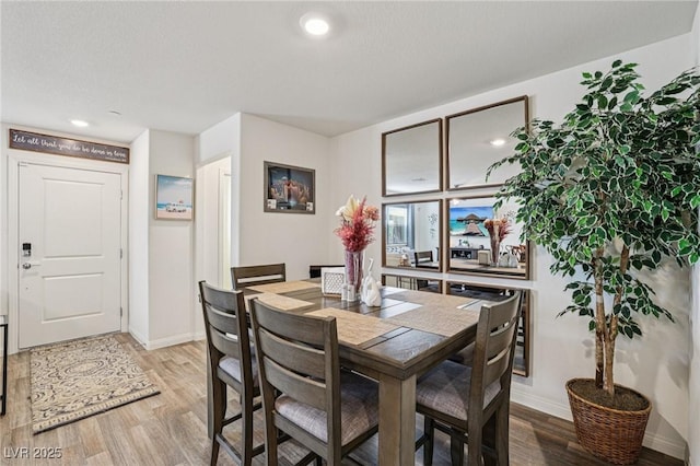 6807 Satin Silver Ct, North Las Vegas, NV 89086 - dining room featuring light wood finished floors, baseboards, and recessed lighting