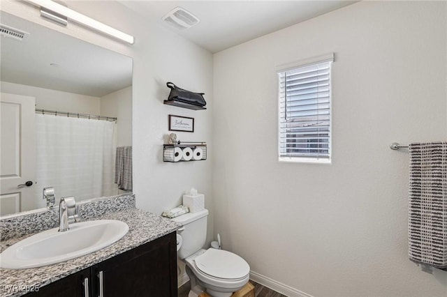 6807 Satin Silver Ct, North Las Vegas, NV 89086 - full bathroom with vanity, toilet, baseboards, and wood finished floors