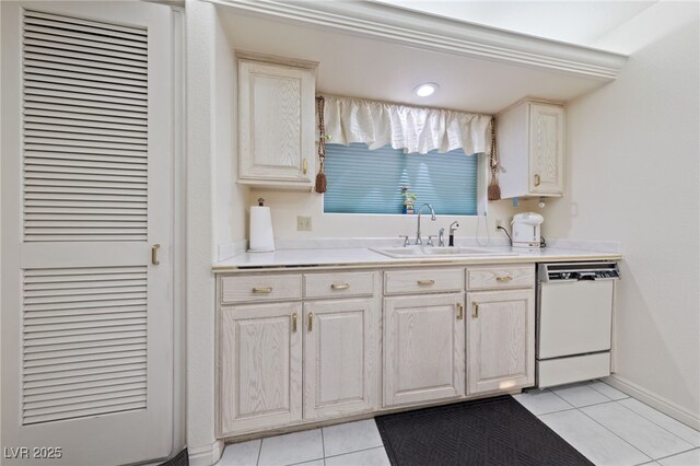 1060 Calico Ridge Dr, Henderson, NV 89011 - kitchen featuring white dishwasher, a sink, light tile patterned flooring, light countertops, and a heating unit