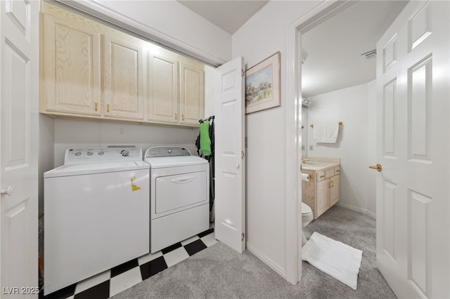 1060 Calico Ridge Dr, Henderson, NV 89011 - laundry room with cabinet space, washer and dryer, light flooring, and baseboards