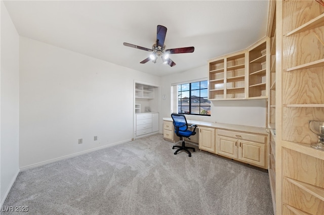 1060 Calico Ridge Dr, Henderson, NV 89011 - unfurnished office featuring light colored carpet, built in desk, ceiling fan, and baseboards
