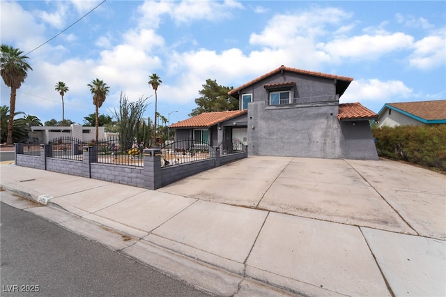 3400 Sioux Way, Las Vegas, NV 89169 - view of front of property with a tiled roof, stucco siding, a fenced front yard, and driveway
