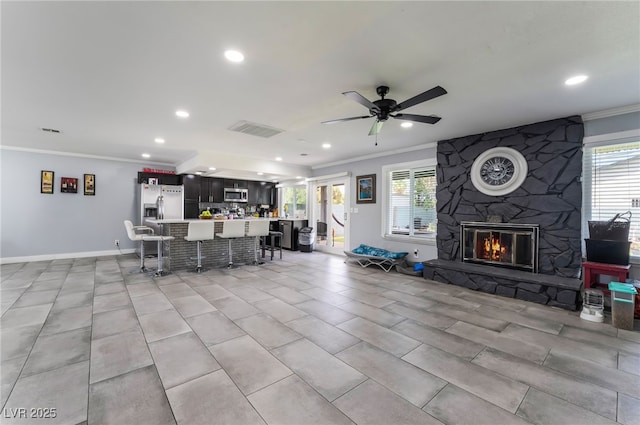 3400 Sioux Way, Las Vegas, NV 89169 - living room featuring crown molding, recessed lighting, ceiling fan, baseboards, and a fireplace