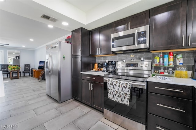 3400 Sioux Way, Las Vegas, NV 89169 - kitchen featuring stainless steel appliances, light countertops, backsplash, dark brown cabinetry, and ornamental molding