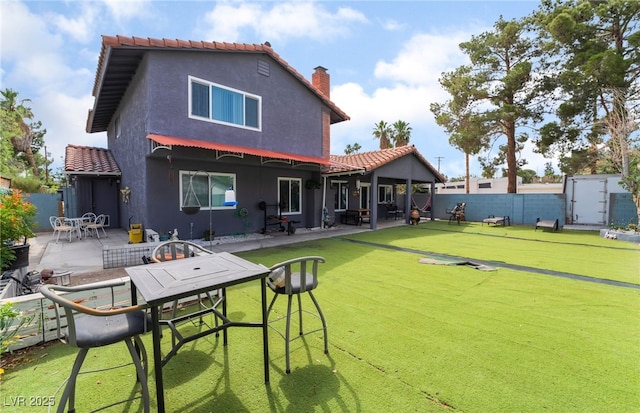 3400 Sioux Way, Las Vegas, NV 89169 - back of property with a tile roof, a patio, stucco siding, and a chimney