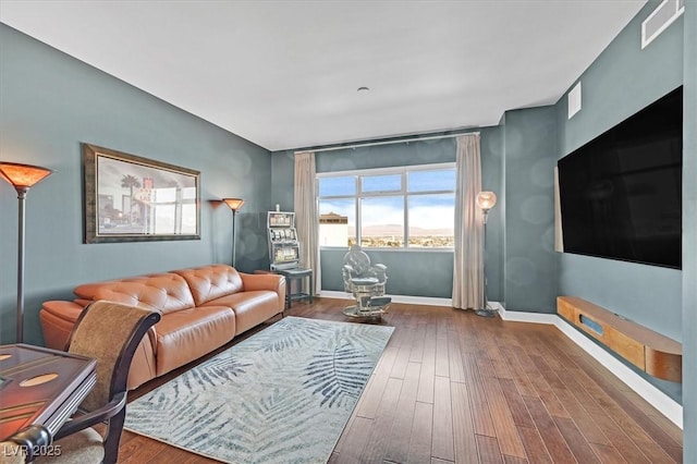 150 Las Vegas Blvd Unit 1004, Las Vegas, NV 89101 - living room with baseboards and dark wood-style floors