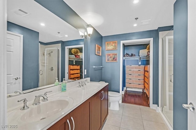 150 Las Vegas Blvd Unit 1004, Las Vegas, NV 89101 - full bath with tile patterned flooring, a stall shower, double vanity, toilet, and baseboards