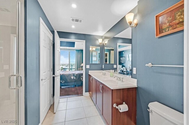 150 Las Vegas Blvd Unit 1004, Las Vegas, NV 89101 - bathroom with ensuite bath, double vanity, tile patterned floors, toilet, and a shower stall
