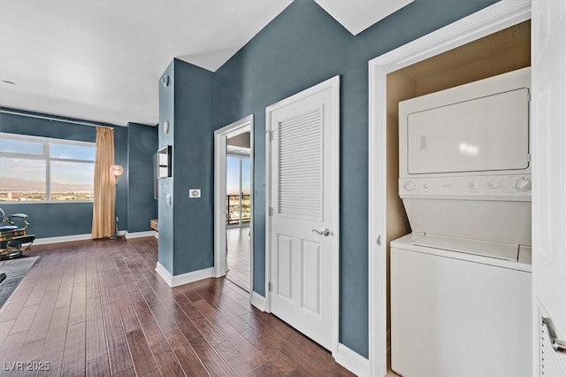 150 Las Vegas Blvd Unit 1004, Las Vegas, NV 89101 - washroom featuring stacked washer / drying machine, dark wood finished floors, and baseboards