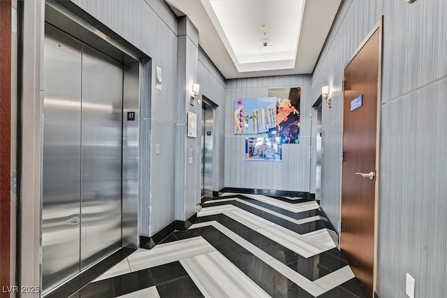 150 Las Vegas Blvd Unit 1004, Las Vegas, NV 89101 - hall with elevator, tile patterned flooring, and baseboards