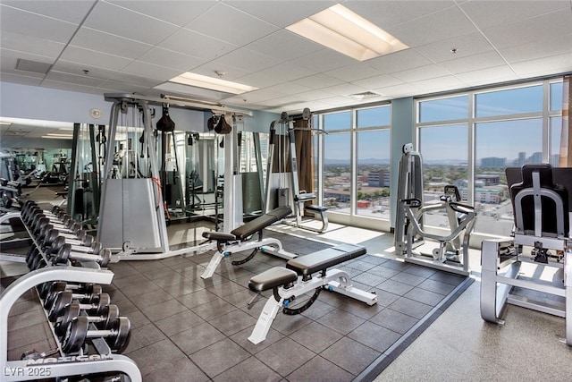 150 Las Vegas Blvd Unit 1004, Las Vegas, NV 89101 - gym featuring floor to ceiling windows, a paneled ceiling, and a city view
