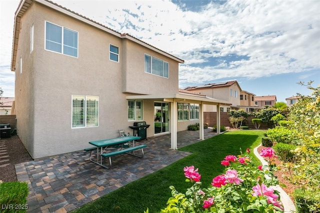2418 Brockton Way, Henderson, NV 89074 - rear view of property featuring stucco siding, a fenced backyard, and a patio area