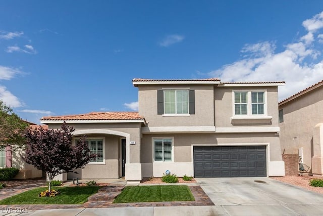 2418 Brockton Way, Henderson, NV 89074 - view of front facade featuring stucco siding, driveway, a garage, and a tiled roof