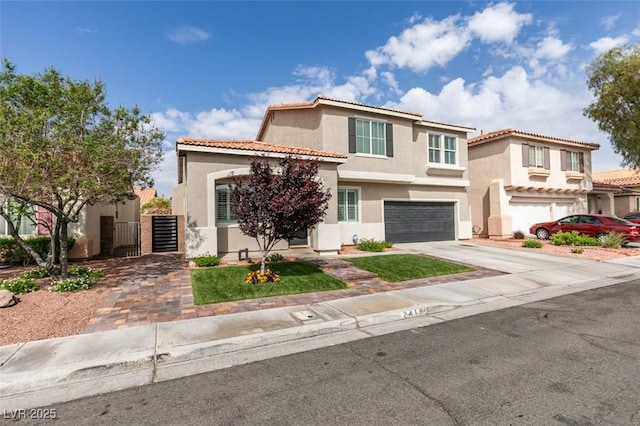 2418 Brockton Way, Henderson, NV 89074 - mediterranean / spanish-style house featuring stucco siding, driveway, an attached garage, and a tile roof