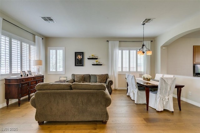 2418 Brockton Way, Henderson, NV 89074 - living area featuring light wood-type flooring and arched walkways