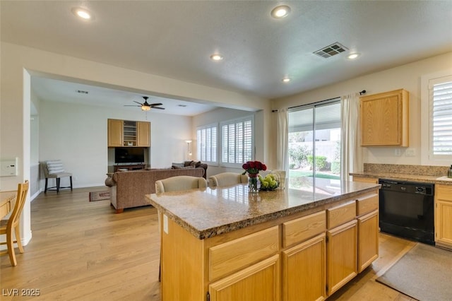 2418 Brockton Way, Henderson, NV 89074 - kitchen with black dishwasher, light wood finished floors, a center island, recessed lighting, and ceiling fan