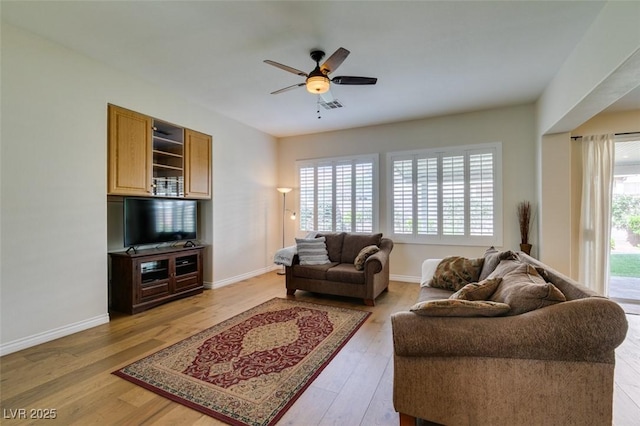 2418 Brockton Way, Henderson, NV 89074 - living room with a ceiling fan and light wood-style floors