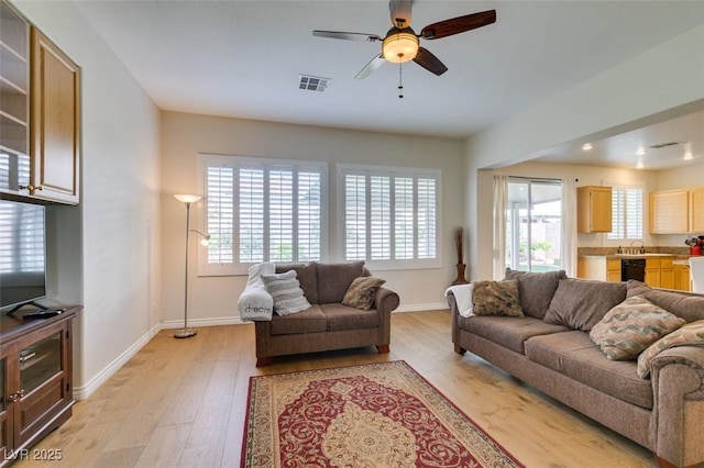 2418 Brockton Way, Henderson, NV 89074 - living room featuring plenty of natural light, light wood-style floors, and ceiling fan