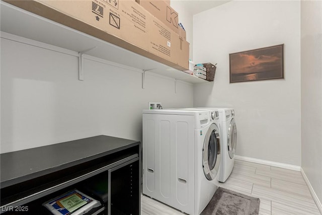 5616 Silver Cascade Ave, Las Vegas, NV 89131 - laundry room featuring washer and dryer, baseboards, and light wood finished floors