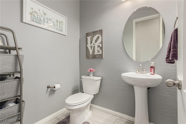 5616 Silver Cascade Ave, Las Vegas, NV 89131 - bathroom with toilet and baseboards