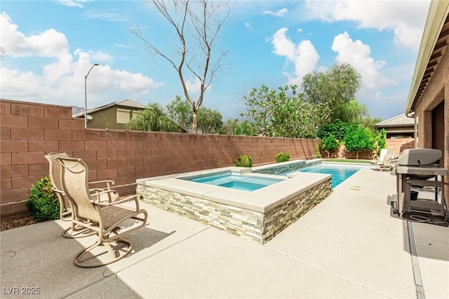 5616 Silver Cascade Ave, Las Vegas, NV 89131 - view of swimming pool with an in-ground hot tub, a fenced backyard, area for grilling, and a patio
